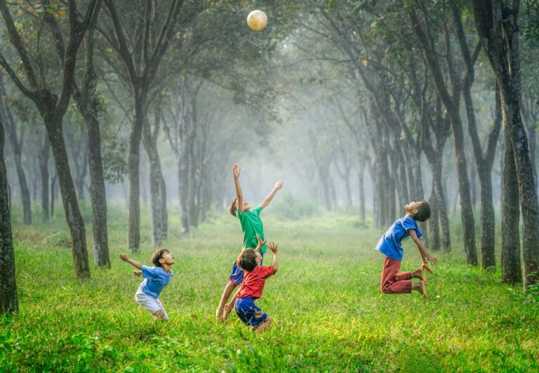 Children playing energetically outdoors, illustrating signs of ADHD in children